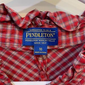 Red plaid button up shirt with ruffle collar